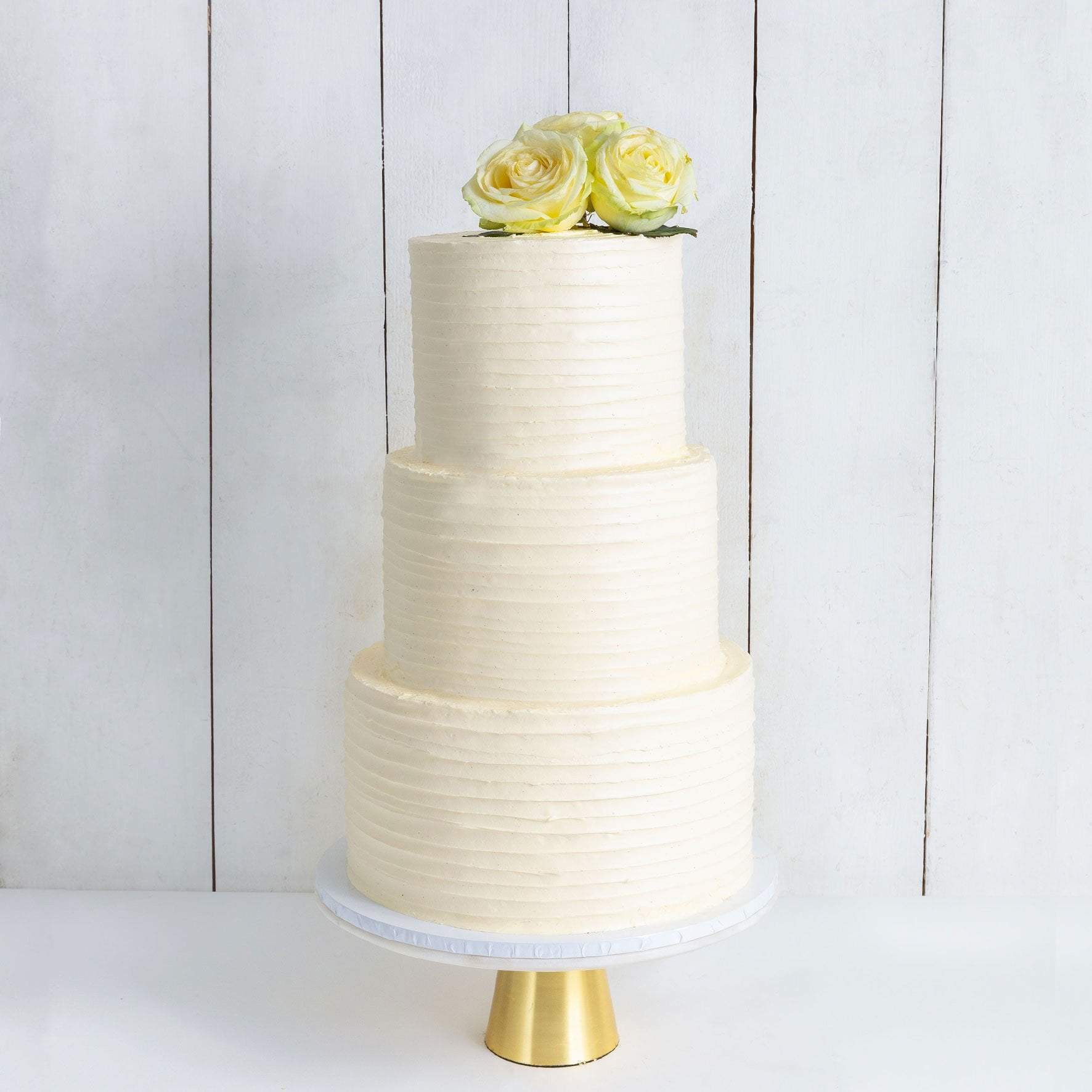 Three Tier Floral Ruffle Wedding Cake – Cutter & Squidge